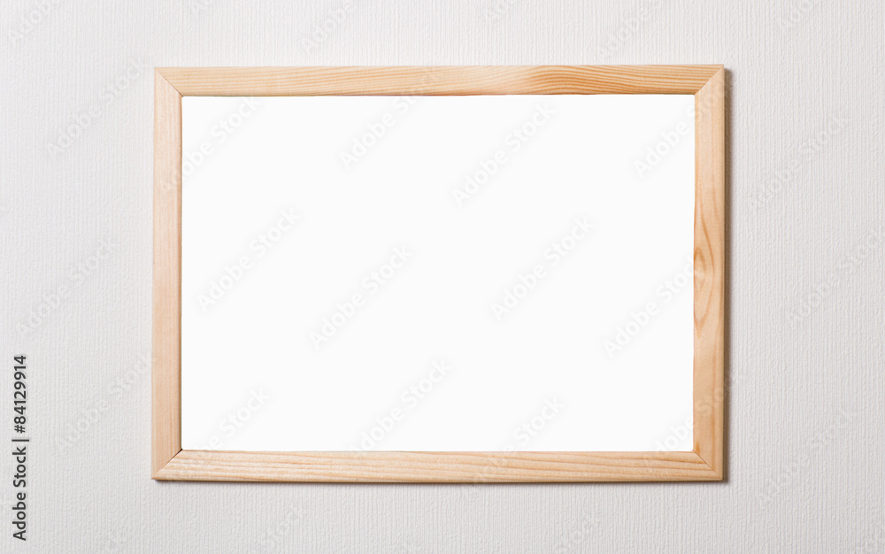 Empty a wooden frame on a white wall Empty a wooden frame on a white wall