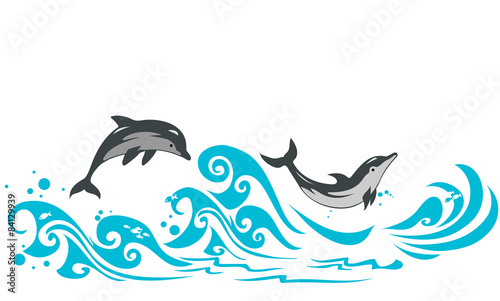 Dolphins jumping in sea waves