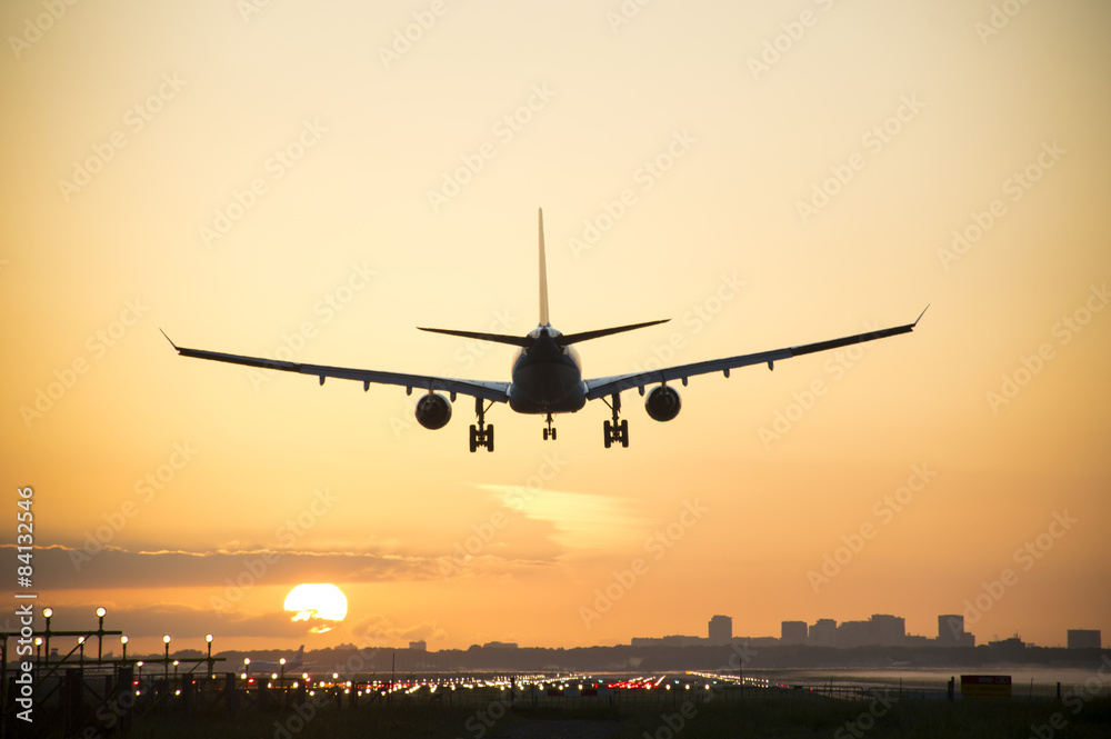 Silhouette from an airplane, photo taken during sunrise.