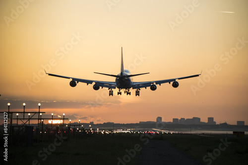 Airplane during landing in the early morning.