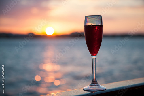 Goblet with red wine photo