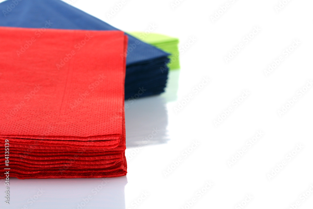 Fototapeta premium Serving colored paper napkins isolated on white background