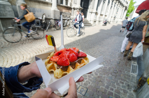 Belgium waffle with chocolate sauce and strawberries