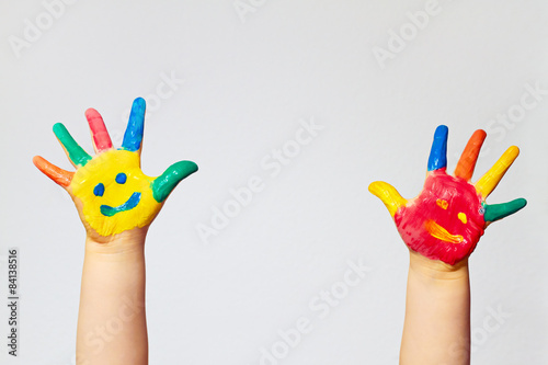 painted hands of little child - happy faces