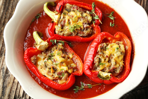 Canvastavla Red peppers stuffed with meat, rice and vegetables