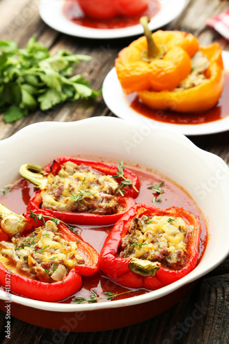 Red and yellow peppers stuffed with meat, rice and vegetables