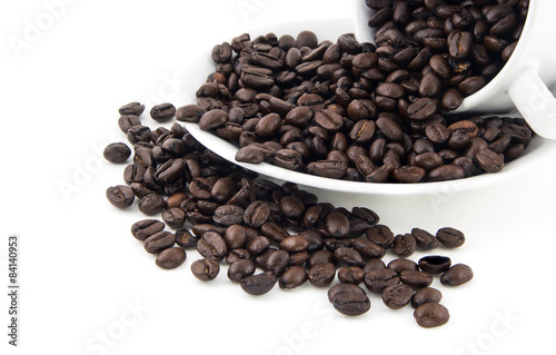 Close up Coffee beans in coffee cup isolated on white