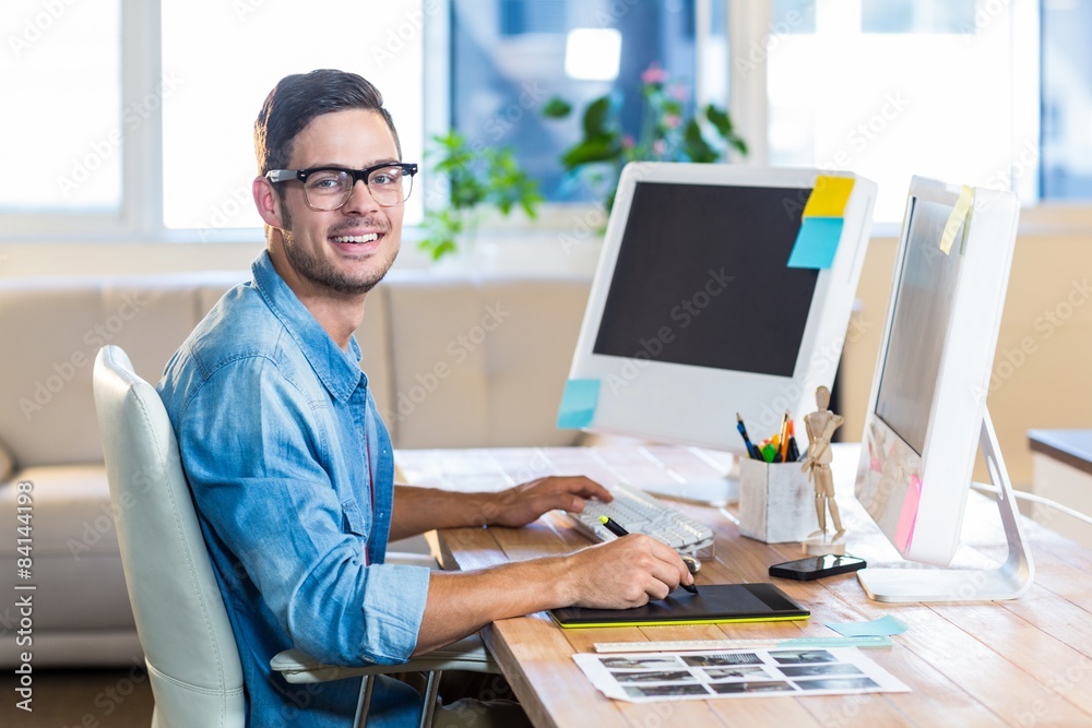 Casual businessman using digitizer at his desk Casual businessman using digitizer at his desk