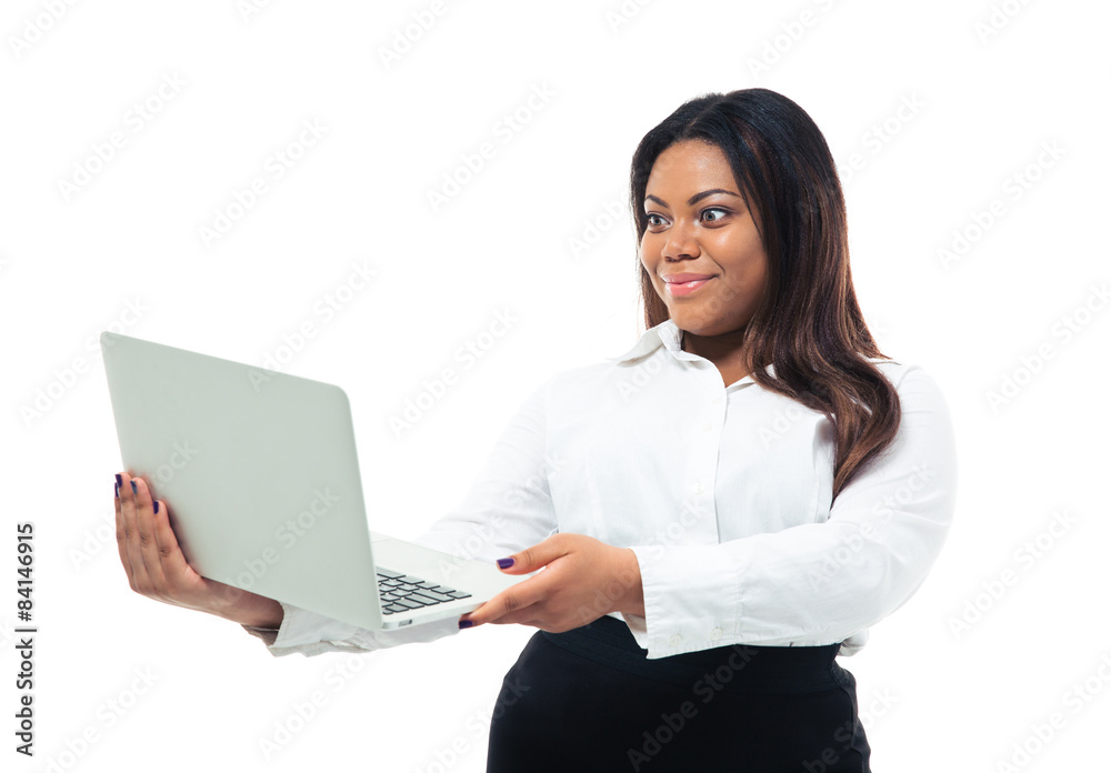 African businesswoman looking at laptop screen African businesswoman looking at laptop screen