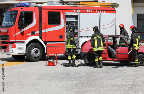 firefighters in action during a car accident