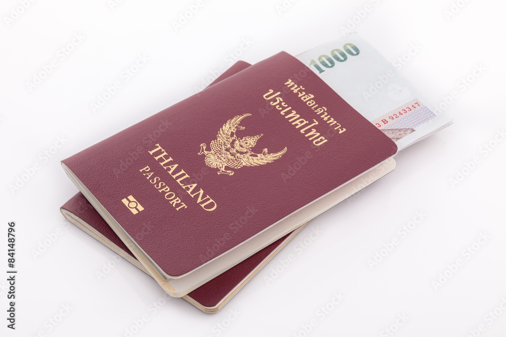 Thailand passport and Thai money for travel isolated on white ba Thailand passport and Thai money for travel isolated on white ba
