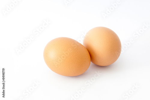brown chicken egg isolated on white.