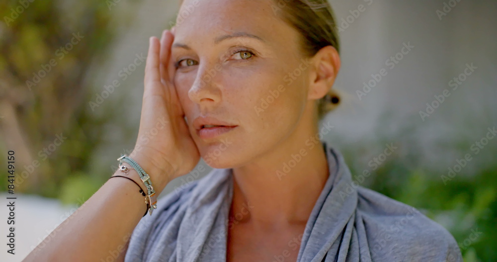 Close Up of Woman Touching Face with Hand