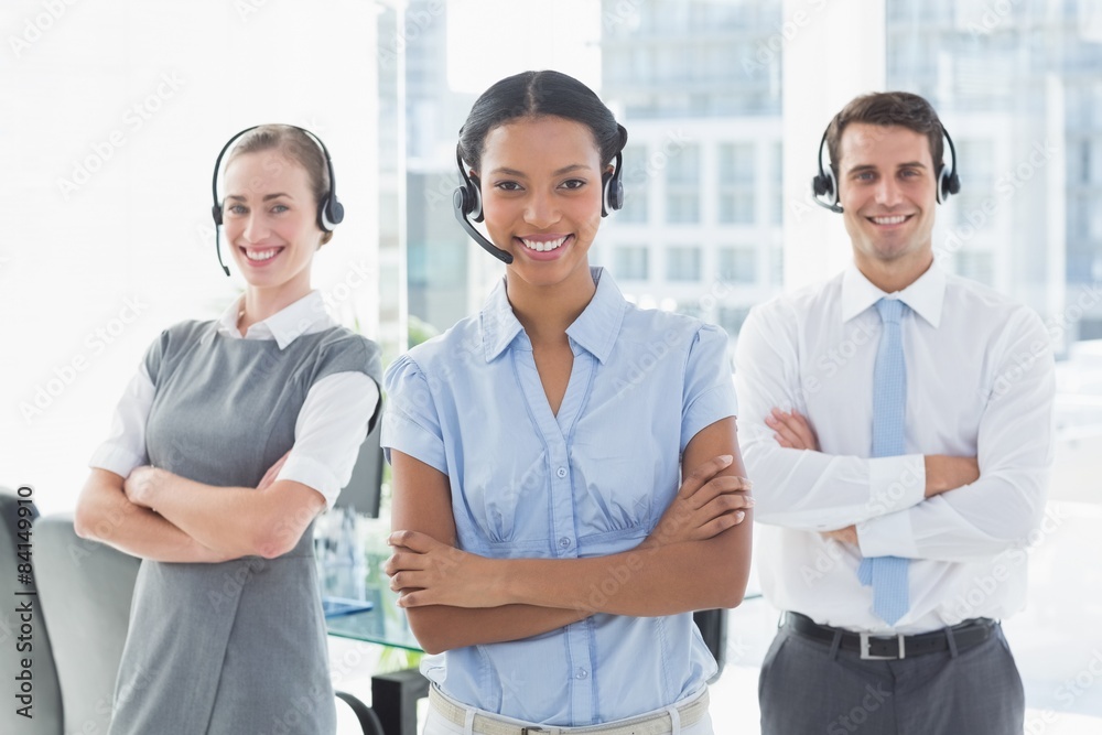 Business people with headsets smiling at camera Business people with headsets smiling at camera