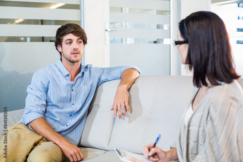 Fototapeta premium Psychologist talking with depressed man