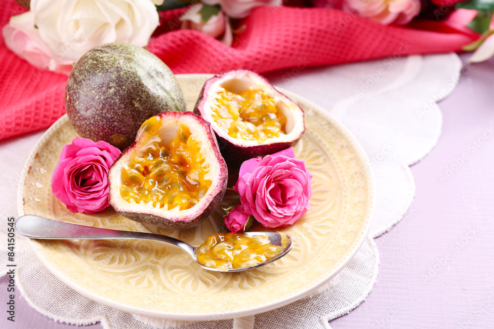Passion fruit on plate on color wooden background Passion fruit on plate on color wooden background