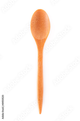 Close-up top view of wooden spoon isolated on white background.