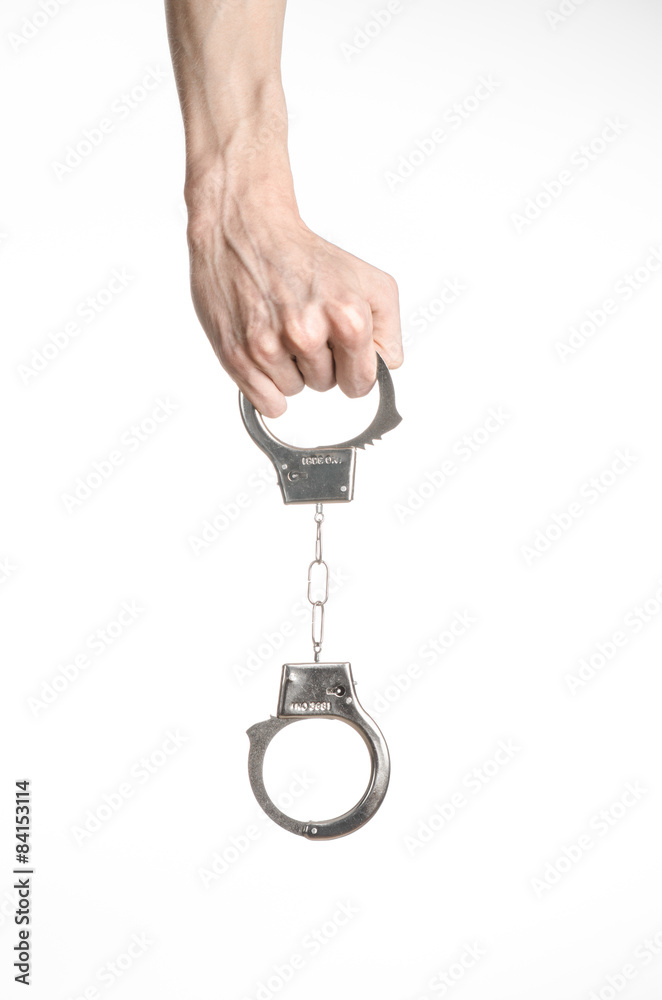 Prison and convicted topic: man hands with handcuffs isolated Prison and convicted topic: man hands with handcuffs isolated