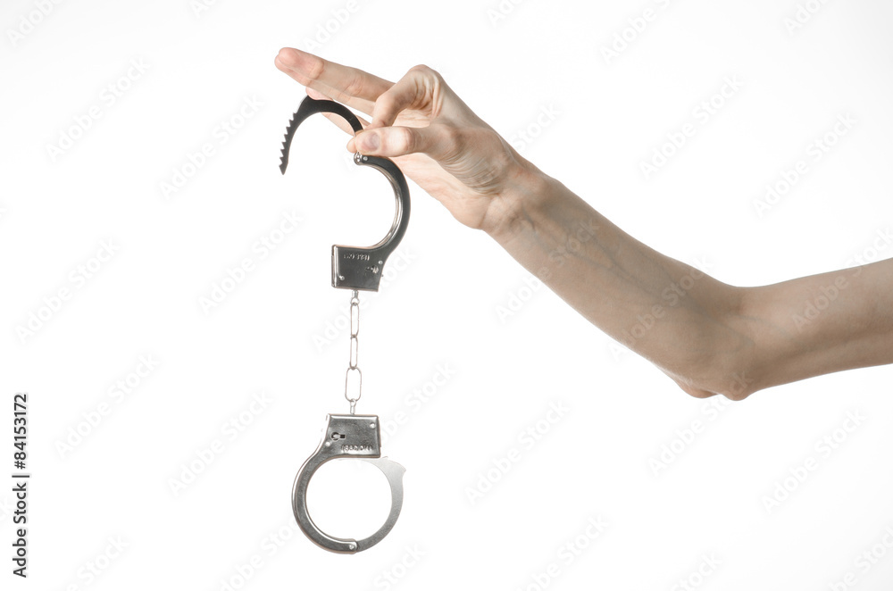 Prison and convicted topic: man hands with handcuffs isolated Prison and convicted topic: man hands with handcuffs isolated