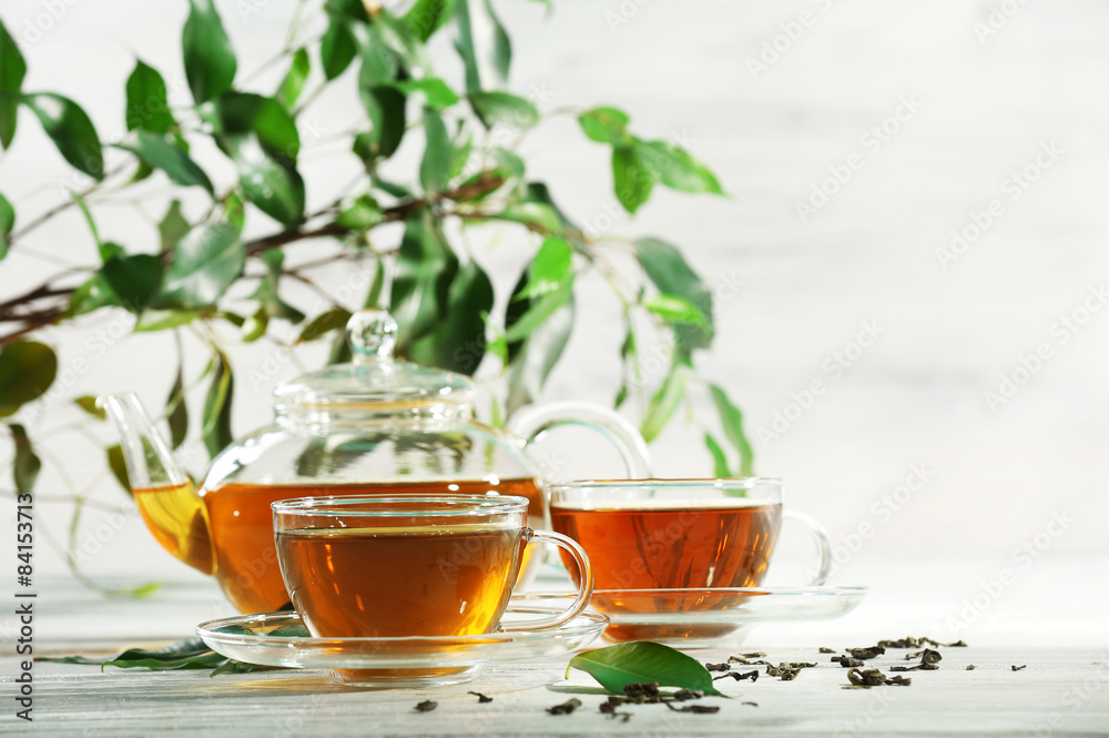 Cups of green tea on table on wooden background Cups of green tea on table on wooden background