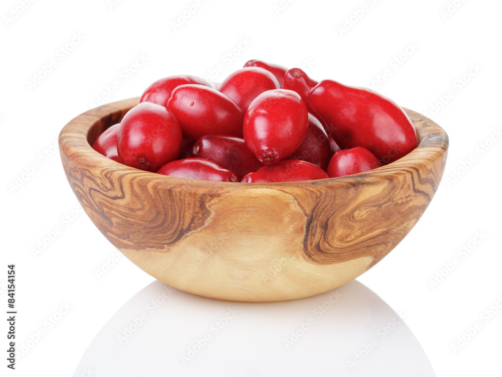 fresh bogwood berries in wood bowl isolated on white fresh bogwood berries in wood bowl isolated on white