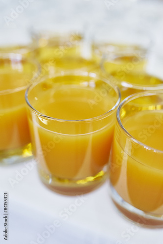 Glasses of orange or peach juice