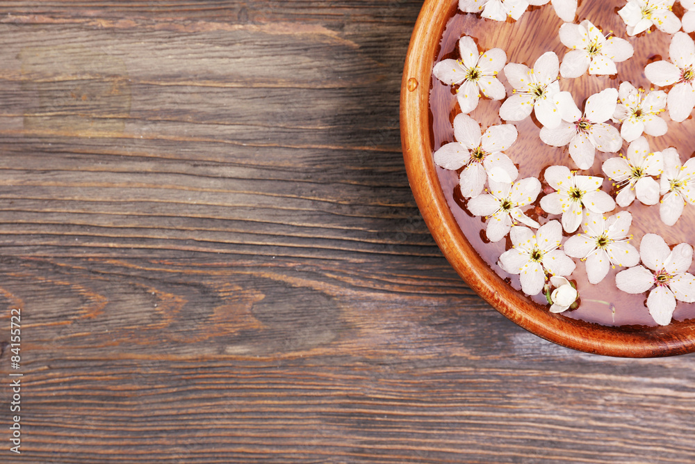Spa still life with petals and candlelight on wooden background Spa still life with petals and candlelight on wooden background