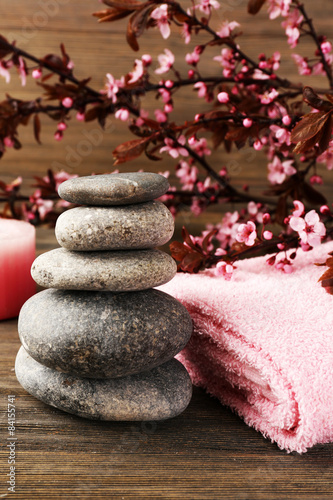 Spa still life with flowering branches on wooden background