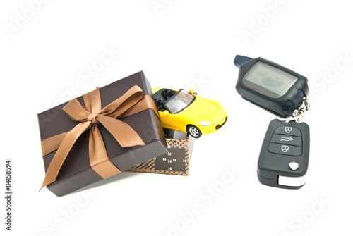 sport car, keys and brown gift box