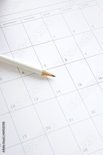 white pencil on blank calendar