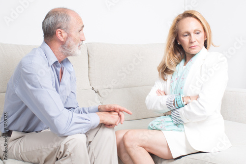 Older man asking sorry for his behavior to wife