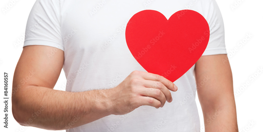 closeup of man hands with heart closeup of man hands with heart