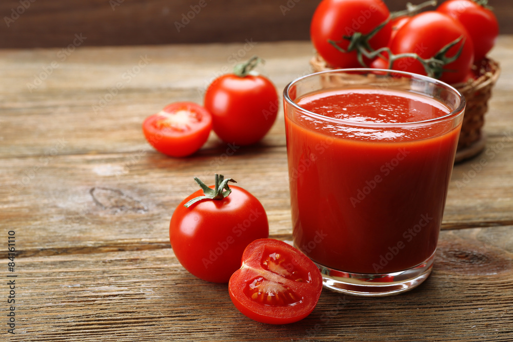 Glass of fresh tomato juice on wooden background Glass of fresh tomato juice on wooden background