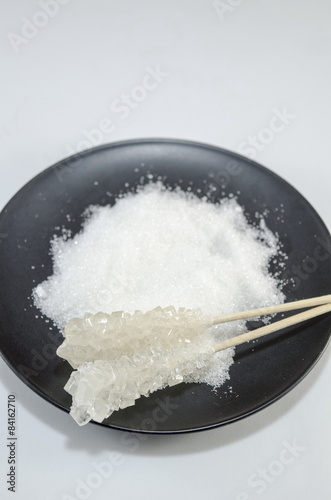 Two sugar sticks containg white and brown sugar