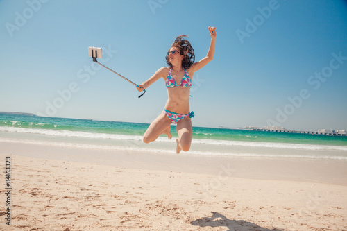 Cheerful Female Taking Selfie At The Seashore