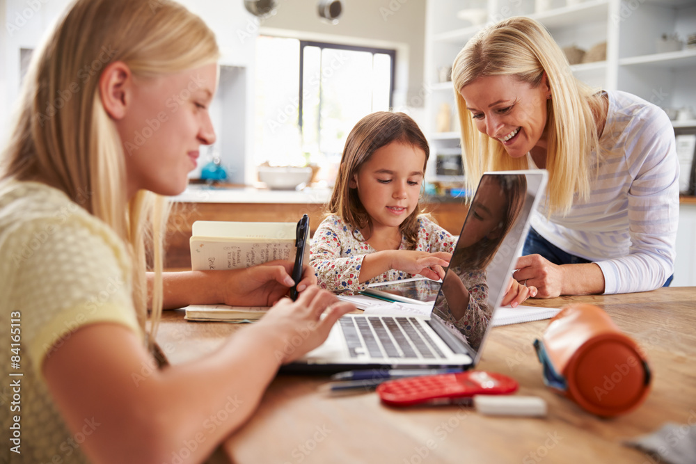 Mother spending time with daughters at home Mother spending time with daughters at home