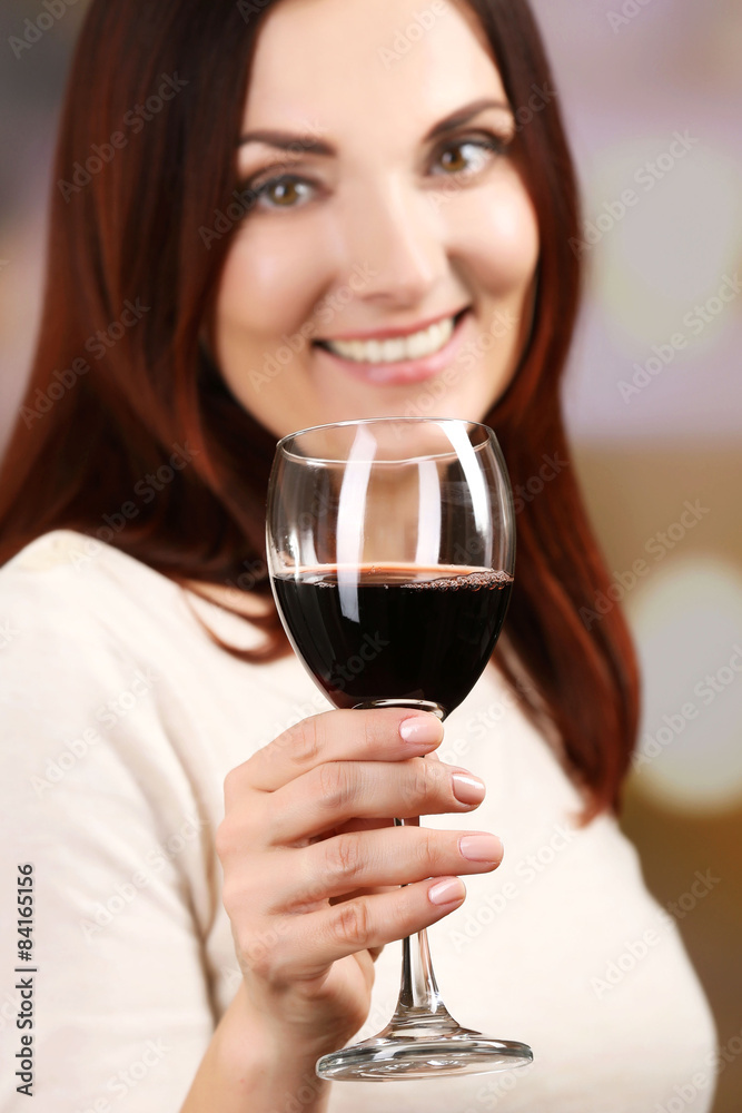 Young woman tasting wine on bright background Young woman tasting wine on bright background