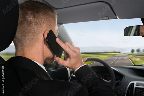 Businessman Talking On Cellphone © Andrey Popov