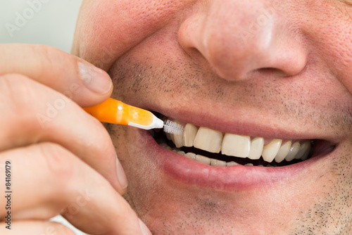 Man Cleaning His Teeth photo