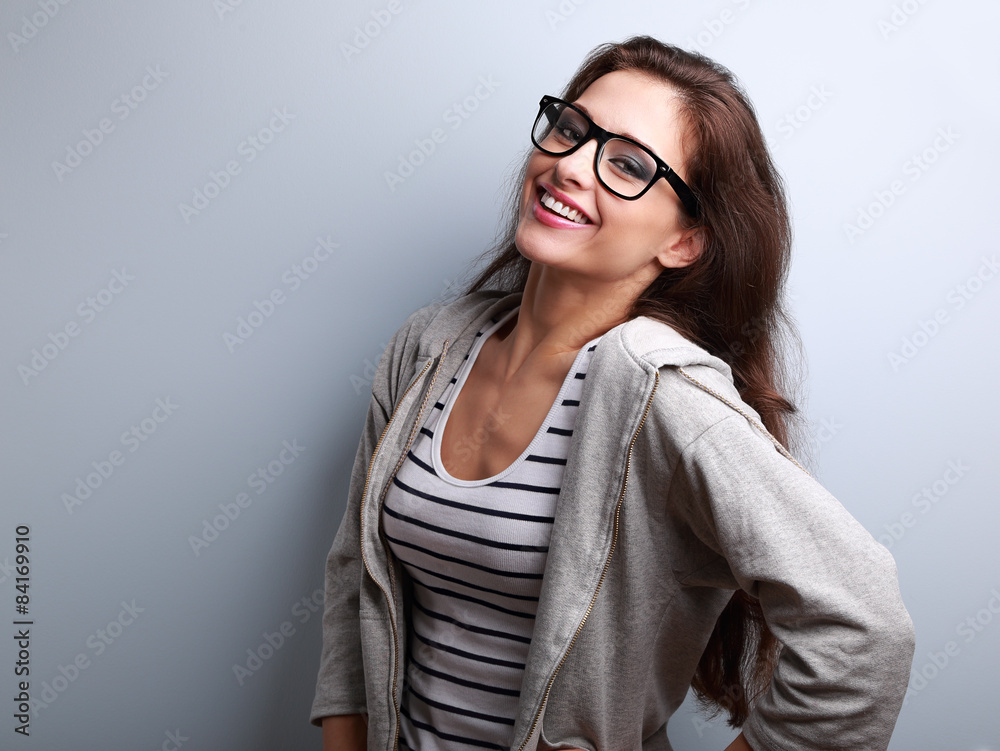 Funny laughing woman in modern glasses on blue background Funny laughing woman in modern glasses on blue background