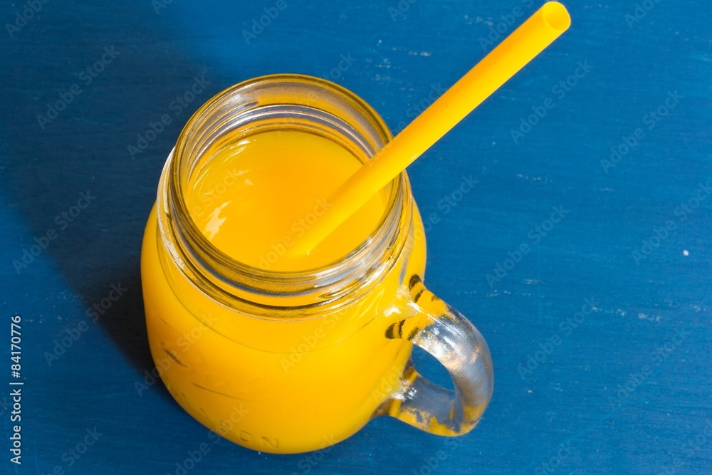 Mango juice on beautiful blue background Stock Photo | Adobe Stock