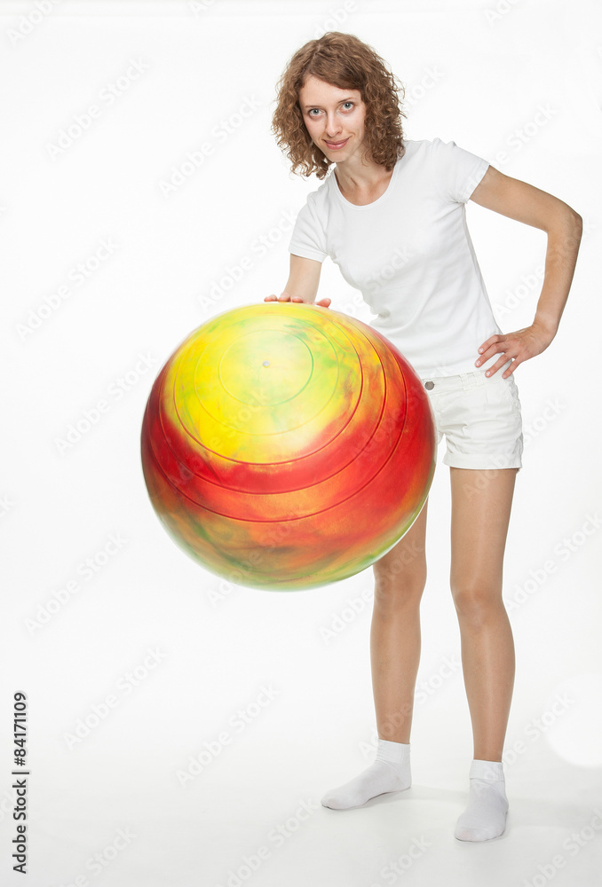 Smiling young woman doing exercises with big fitball Smiling young woman doing exercises with big fitball