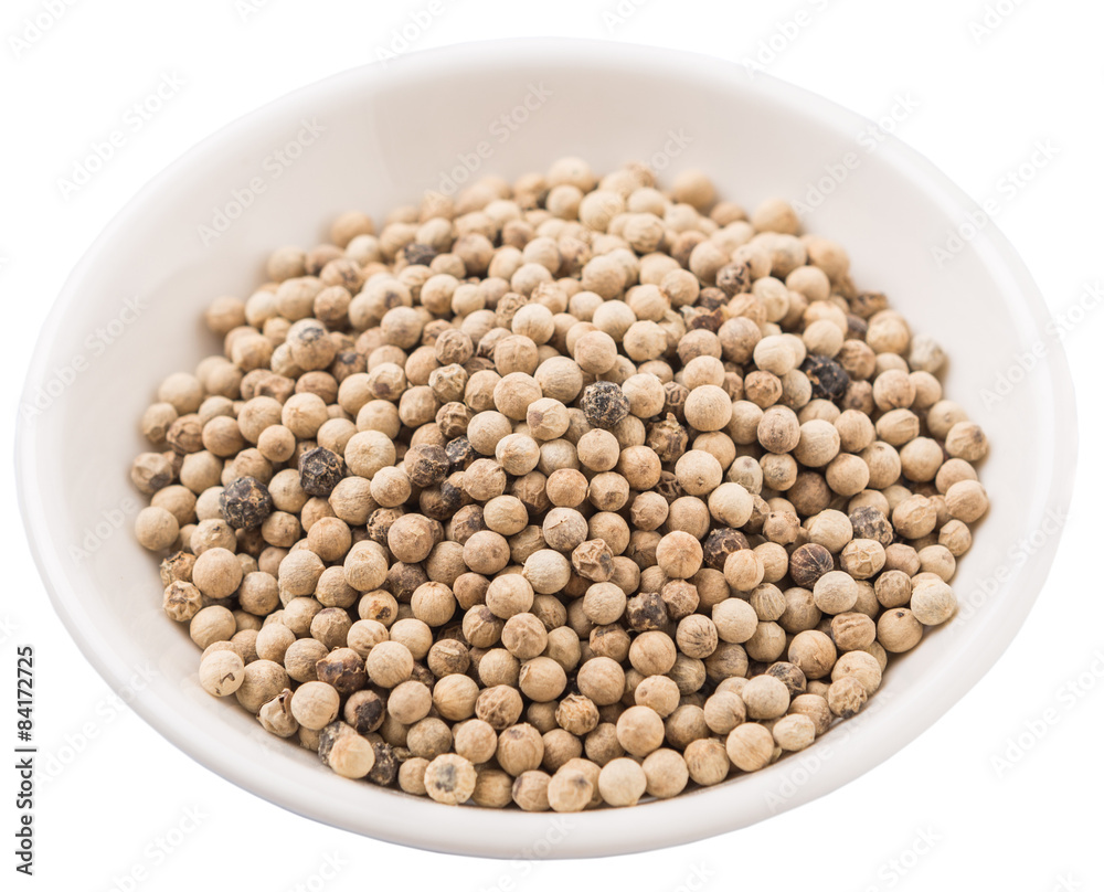 White pepper in white bowl over white background White pepper in white bowl over white background