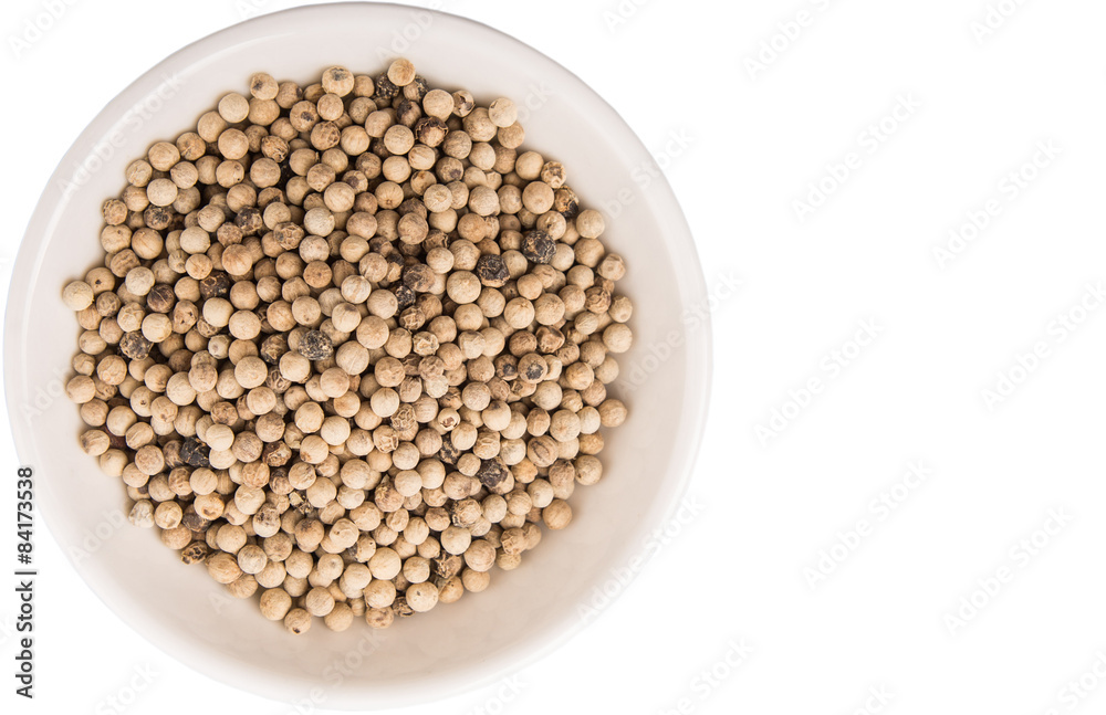 White pepper in white bowl over white background