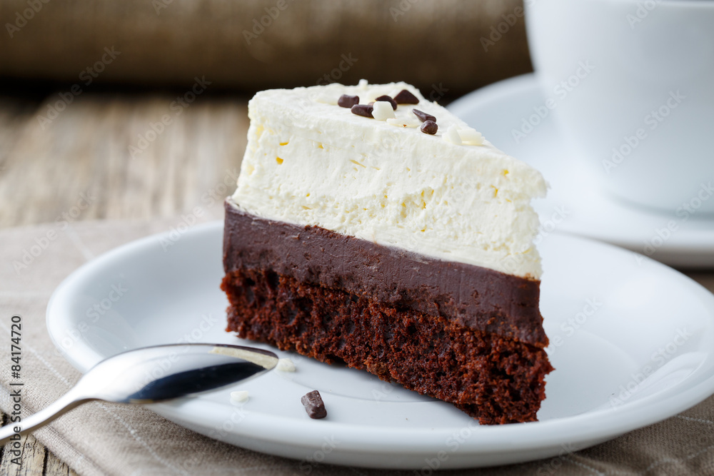 Vanilla cheesecake slice on wooden background. Vanilla cheesecake slice on wooden background.