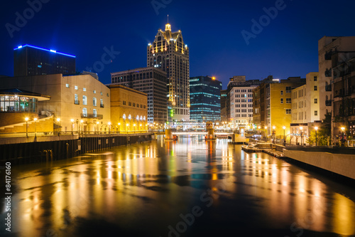 Buildings along the Milwaukee River at night, in Milwaukee, Wisc photo