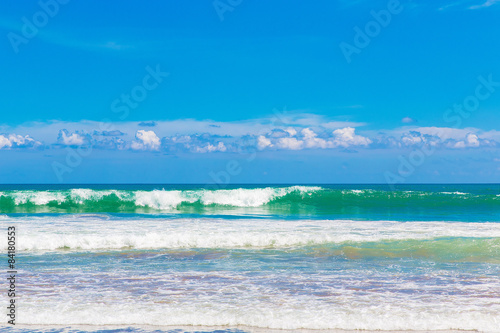 Tropical beach and beautiful sea. Blue sky with clouds in the ba