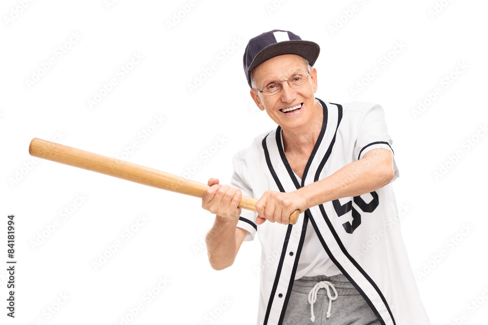 Senior in a baseball jersey swinging a baseball bat and looking Senior in a baseball jersey swinging a baseball bat and looking