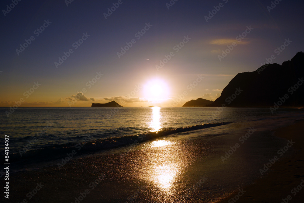 Early Morning Sunrise on Waimanalo Beach over Rock Island bursti