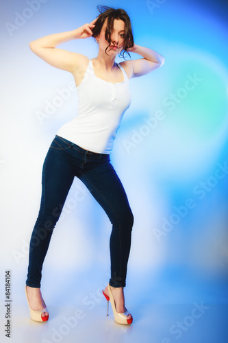 plus size woman in casual clothes posing in studio